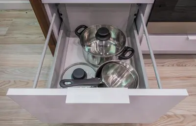 a drawer with some pots and pans in it at BAKO Apartments in Skawina