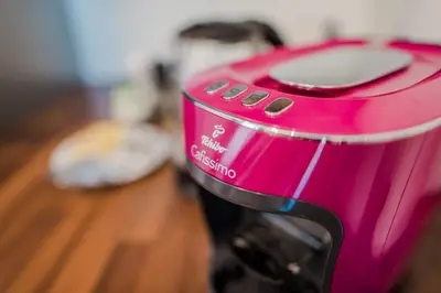 a pink toaster sitting on top of a table at BAKO Apartments in Skawina