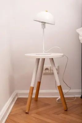 a white table with a lamp on top of it at Kazimierz Pearl Apartments in Kraków