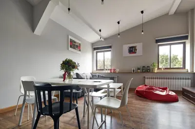 a dining room with a table and chairs at PlayHouse Apartments in Kraków