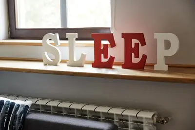 a shelf with a sign that says stop at PlayHouse Apartments in Kraków