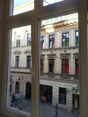 a view of a building from a window at Florianska Apartment in Kraków