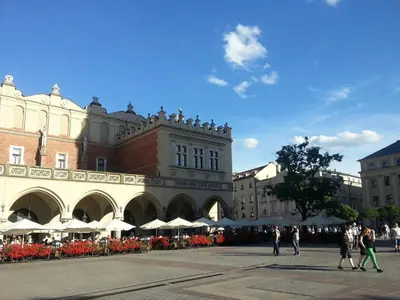 a group of people walking in front of a building at Florianska Apartment in Kraków