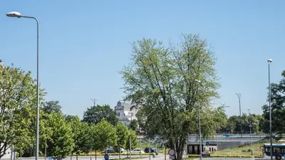 a park with trees and a street light and a building at Apartment Nearto Old Town Na Ustroniu street in Kraków
