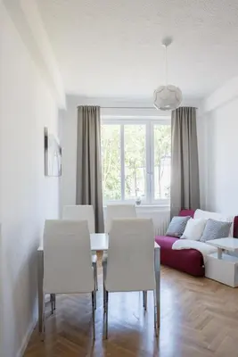 a living room with a table and chairs and a couch at Apartment Nearto Old Town Na Ustroniu street in Kraków