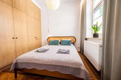 a bowl of fruit on a table in a living room at Trip Apartments in Kraków