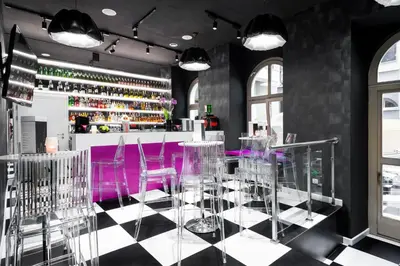 a bar with purple chairs and a purple counter at Best Western Plus Krakow Old Town in Kraków