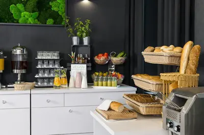 a counter with baskets of bread and other foods at Best Western Plus Krakow Old Town in Kraków