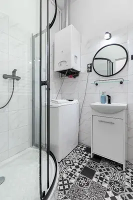 a bathroom with a shower and a sink at Friendhouse Apartments Avenue in Kraków