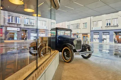 an old car is on display in a museum at INX Design Hotel in Kraków