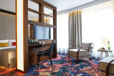 a hotel room with a bed and a desk and a chair at INX Design Hotel in Kraków