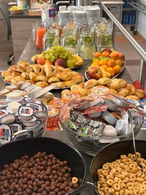 a buffet filled with lots of different types of food at Pastoral Lodge at the Sanctuary of the Divine Mercy in Kraków