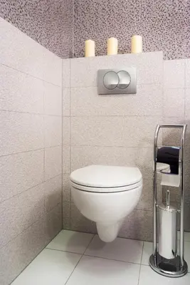 a bathroom with a white toilet in a room at Cracow Stay Apartments in Kraków
