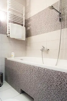 a bathroom with a bath tub and a shower at Cracow Stay Apartments in Kraków