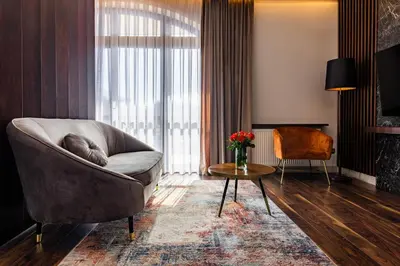 a living room with a couch and a table at Hotel Galicja Superior Wellness & Spa in Oświęcim