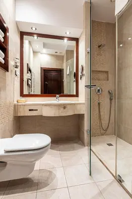 a bathroom with a toilet and a shower at Hotel Galicja Superior Wellness & Spa in Oświęcim