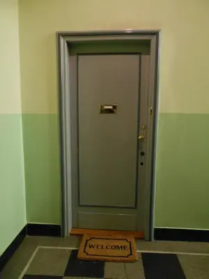 a door with a welcome sign in front of it at Apartament Krakowski Styl in Kraków