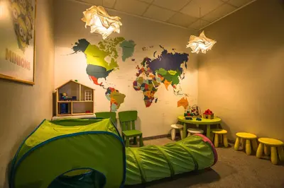 a room with a map of the world on the wall at ParkHotel Łysoń in Inwałd