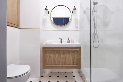 a bathroom with a sink and a shower at Apartamenty Józefa Kazimierz in Kraków