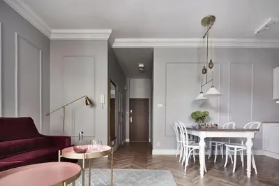 a living room with a couch and a table at Apartamenty Józefa Kazimierz in Kraków