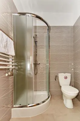 a bathroom with a shower and a toilet in it at Pokoje U Filipa in Kraków