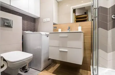a bathroom with a toilet and a sink and a shower at Topolowa Apartment, next to Main Station in Kraków