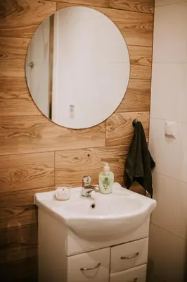a bathroom with a sink and a mirror at Domki,,Chatki Góralskie 