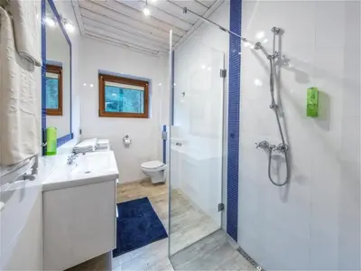 a bathroom with a shower and a sink at Apartamenty 58 Czarny Groń in Rzyki
