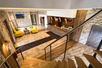 an overhead view of a living room with a staircase at Hotel Beskidzki Raj Medical SPA in Stryszawa