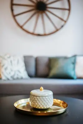 a bowl on a gold plate on a table at Szpitalna 20 Apartment 3 in Kraków