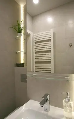 a bathroom with a sink and a mirror at MJZ Apartments Old Town Krakow in Kraków