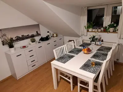 a kitchen with a white table and white cabinets at Willa Krakowia in Krzeszowice