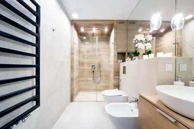 a bathroom with a shower and a toilet and a sink at LEMIR Apartments Wawrzyńca 21 in Kraków