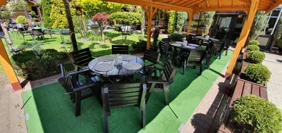 an overhead view of a patio with tables and chairs at Eko Hotel Na Wierzynka & Park Pinokia in Wieliczka