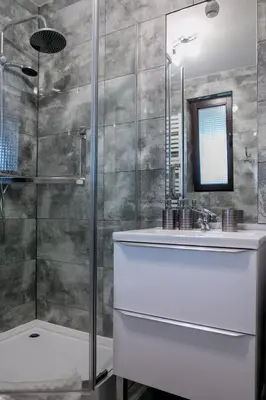 a bathroom with a white sink and a shower at Eko Hotel Na Wierzynka & Park Pinokia in Wieliczka