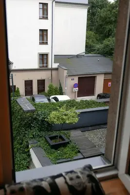 a view of a building from a window at Sunflower Apartment in Kraków