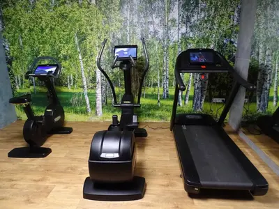 a group of three exercise bikes in a gym at Margerita in Modlnica