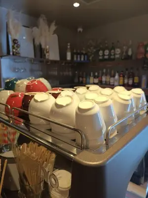 a shelf filled with lots of milk bottles at Hotel Kolna - darmowy parking, basen w cenie in Kraków