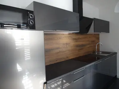 a kitchen with a sink and a counter top at Blue Apartment Oświęcim in Oświęcim