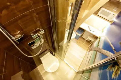 an overhead view of a bathroom with a toilet at Yourplace XXS Apartments in Kraków