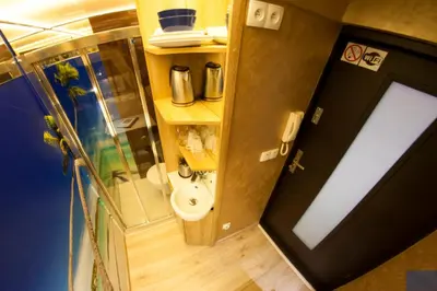a small bathroom with a toilet and a sink at Yourplace XXS Apartments in Kraków