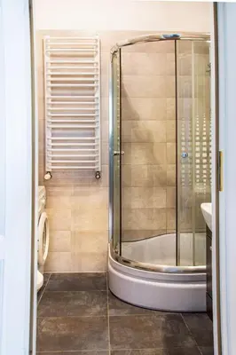 a bathroom with a shower and a toilet and a sink at Florianska Gate Luxury Apartments in Kraków