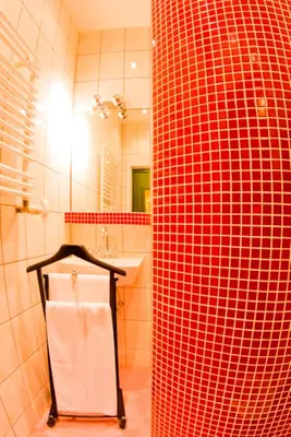 a bathroom with a sink and a white towel at Apartament Kopernik in Kraków