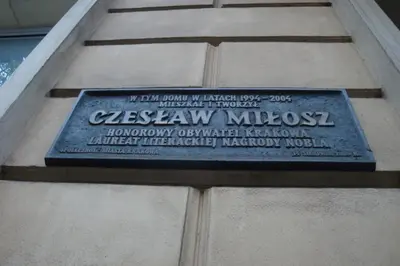 a plaque on the side of a building at Apartament Jonek in Kraków