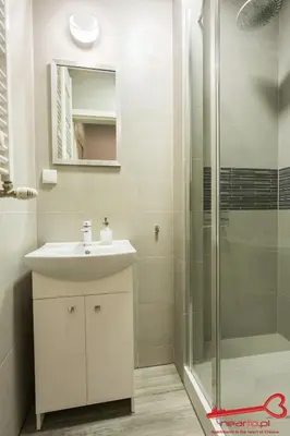 a bathroom with a sink and a shower at Apartment Old Town Topolowa in Kraków