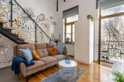 a living room with a couch and a table at Home Sweet Home in Kraków