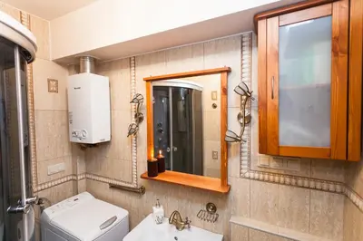 a bathroom with a toilet and a sink and a mirror at Angel's studio - Jewish Quarter, Old Town (AirCon) in Kraków