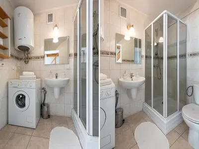 a bathroom with a toilet sink and a washing machine at Studio Smart Apartment in Kraków