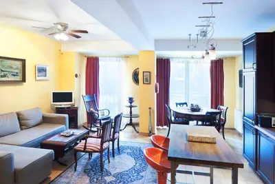a living room with a couch and a table at Trinity Apartment in Kraków