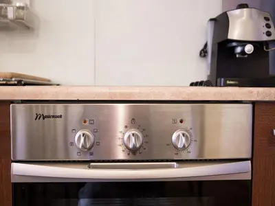 a microwave oven in a kitchen with a counter at Old Town Apartment in Kraków
